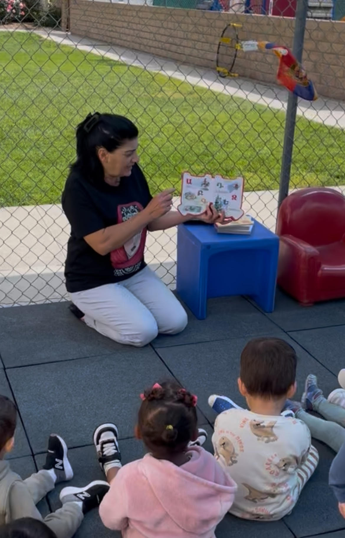 woman teaching kids